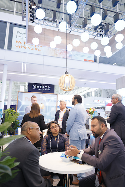 Multiple people talking at convention