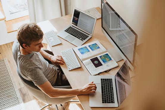 Aerial view of man working on computer at desk