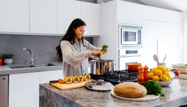Woman cooking in kitchen
