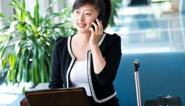 Corporate traveler on phone